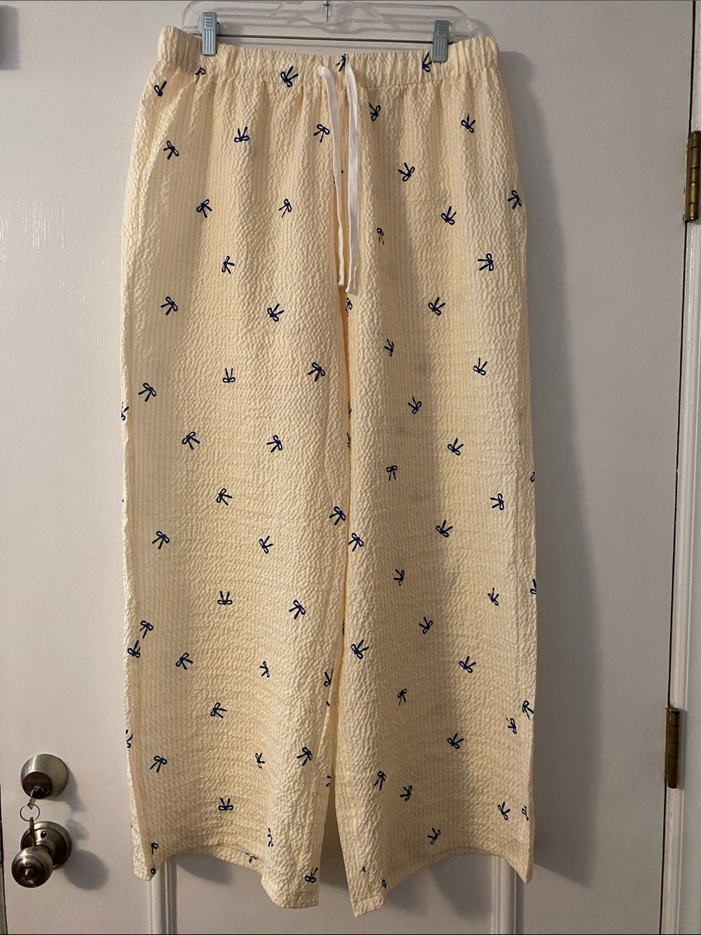 SHEIN Yellow and White seer sucker Stripe Pants with Navy Bow Print